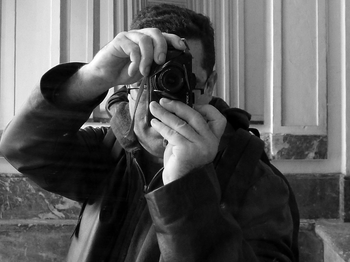 Erik Westerman photographing with a film camera